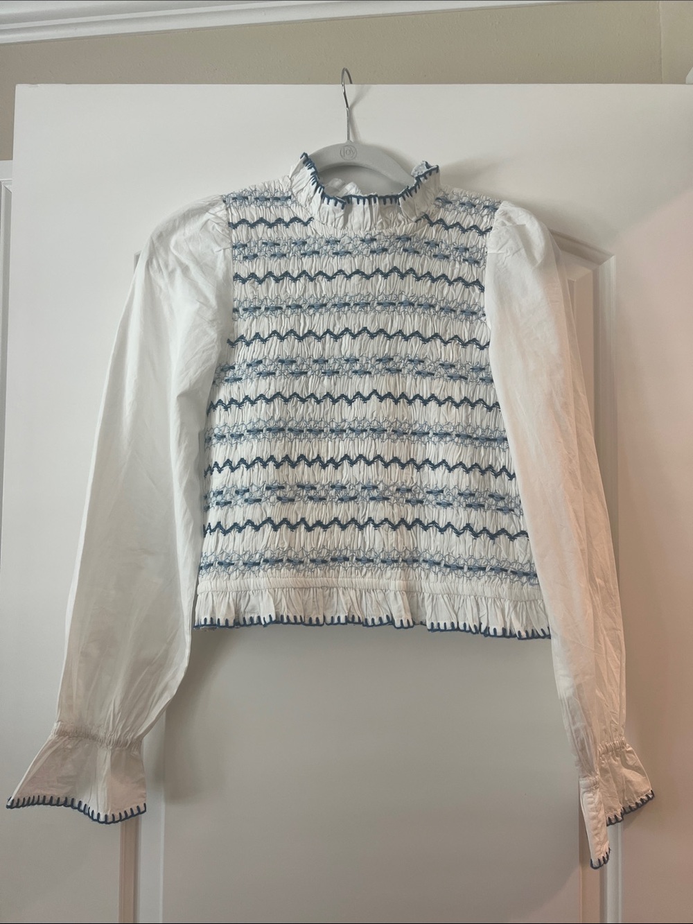 Sezane White Smocked Blouse with Blue Trim. This blouse has not been worn.